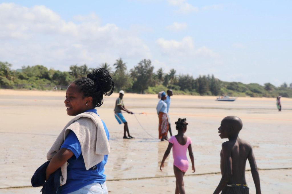 Children on the beach at low tide in Vilanculos