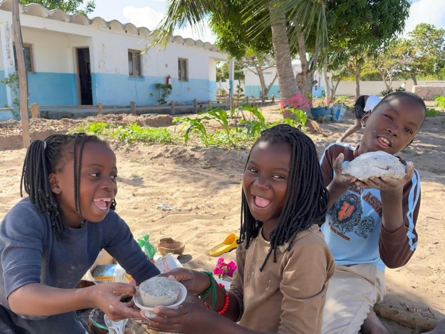 Children laughing together at a picnic